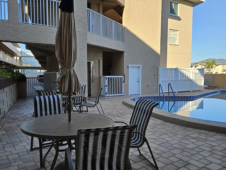 Pool with plenty of tables and chairs