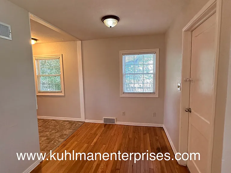 Entry to partial unfinished basement is right off of the front living room and tied to the garage entry.