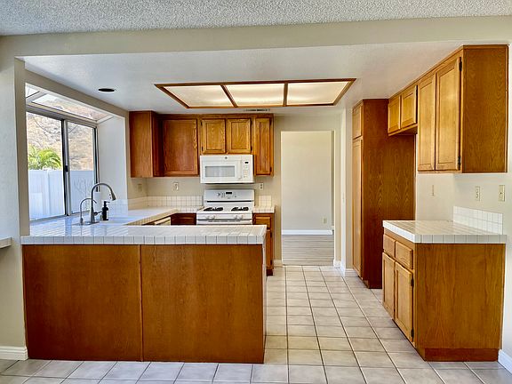 Large kitchen with plenty cabinets and connects to family room