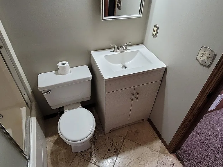 Bathroom - Brand new vanity. Mirror is a small medicine cabinet.