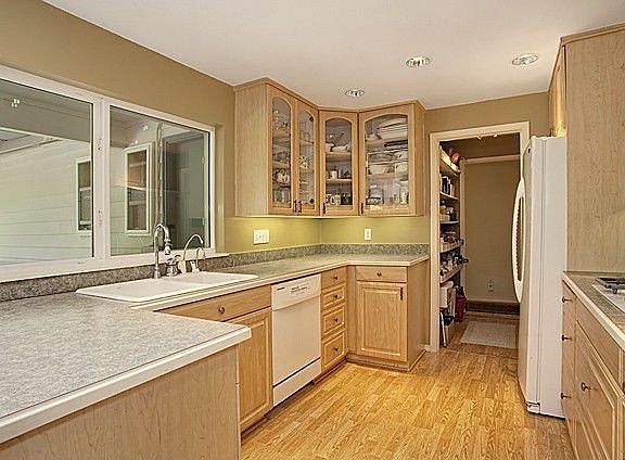 Bright kitchen with huge window! Gas stove, double oven and recessed lighting.