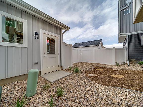 Backyard leading to detached garage.