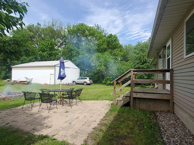 Large backyard w/ firepit and room for storage.