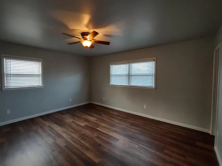Generous sized master bedroom with two closets and bathroom.