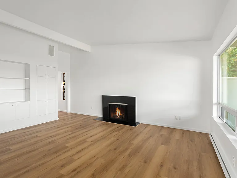 Living room with built in storage shelves