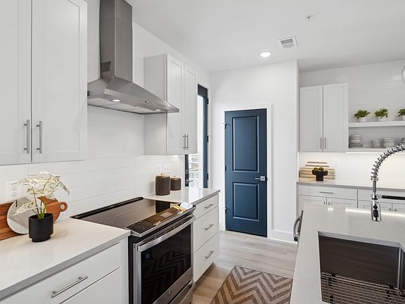 Kitchen with stainless steel hood