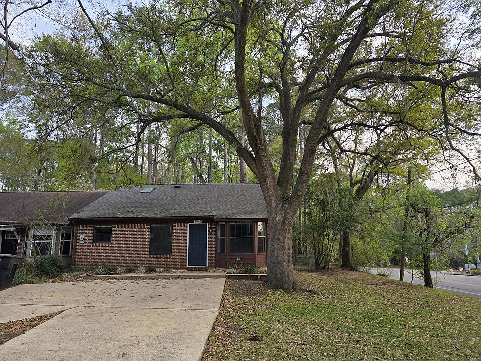 Front of the house with driveway accommodating at least 4 cars!