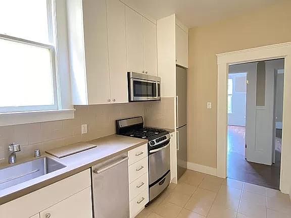 Kitchen: Recently remodeled w/new cabinets, flooring and stainless steel appliances--including dishwasher.
View-Towards Kitchen Hallway