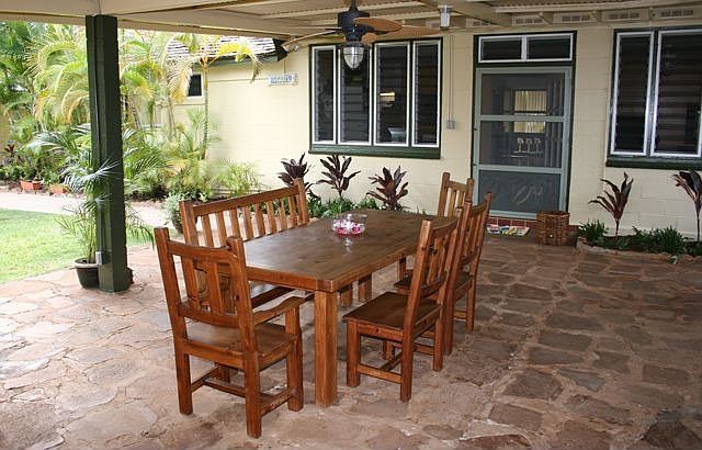 Large outdoor lanai overlooks a lush garden