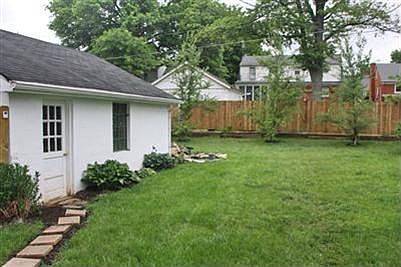 Back yard with view of 2 car garage