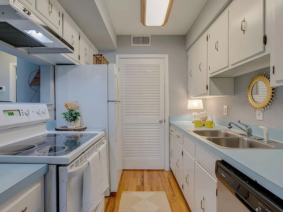 Kitchen with Doorway to Washer and Dryer Room Note Counter Tops have been replaced with White Marbel