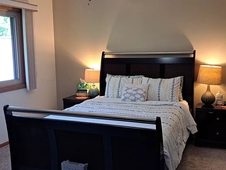 master bedroom with walk in closet and vanity