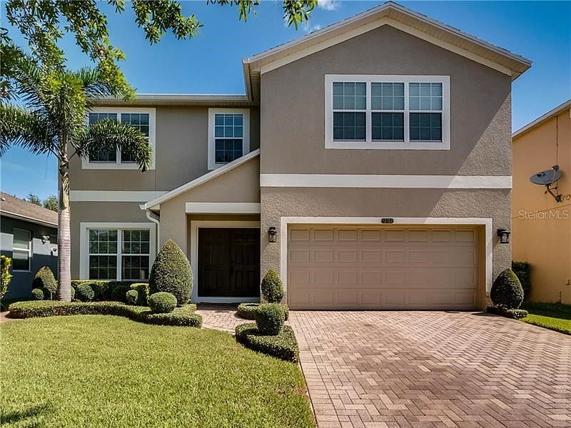 Beautifully landscaped front view.