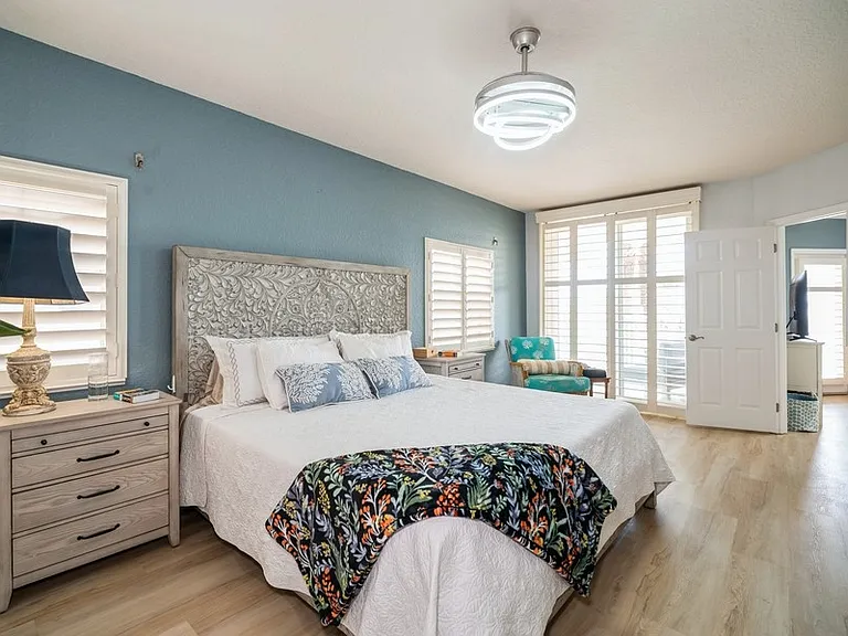Primary bedroom has direct access to the balcony