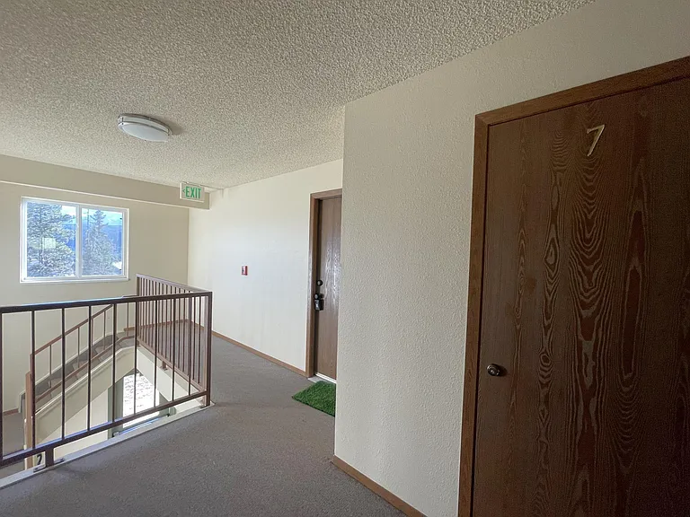 Landing, condo entry, and storage entry