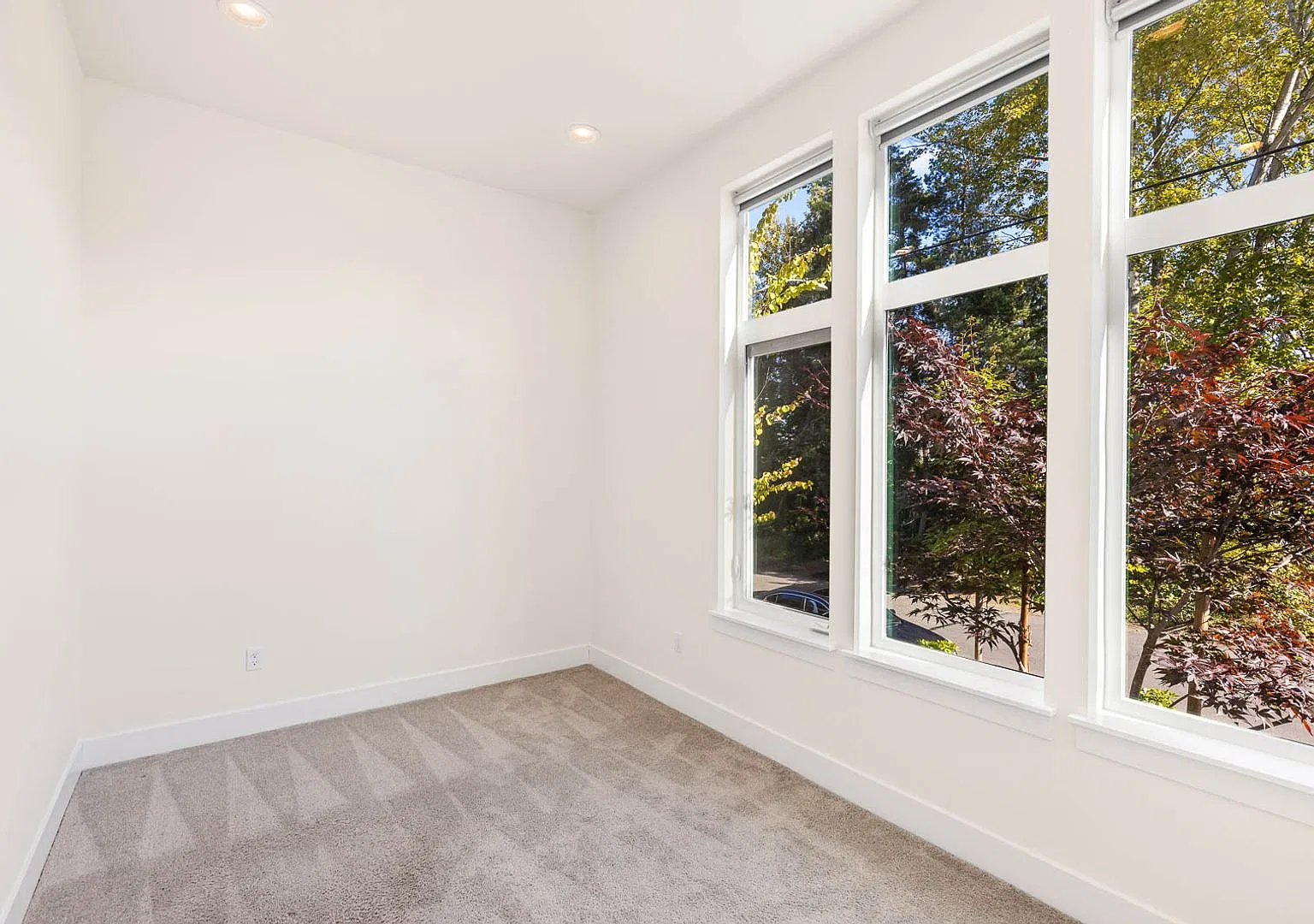 Modern Corner Home with Abundant Natural Light, Spacious Balcony & 2-Car Garage! — Photo 2