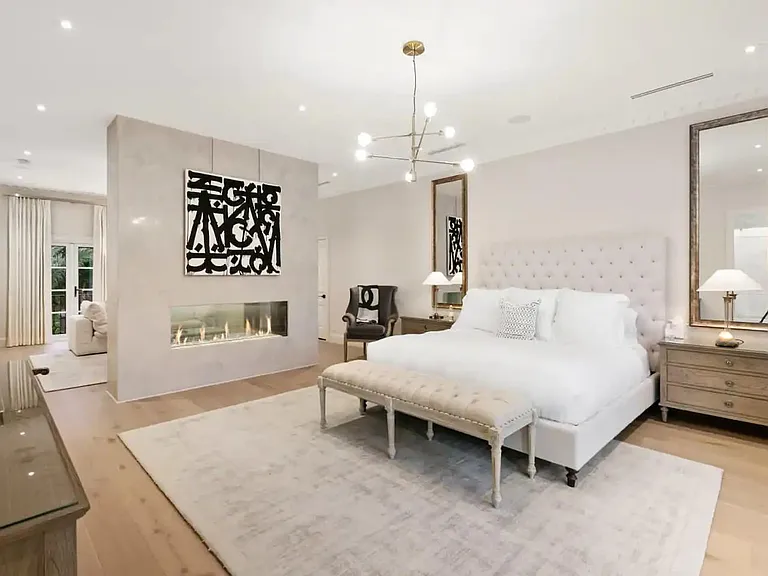 Master bedroom with King size bed, dual sided fire place for ultimate enjoyment.