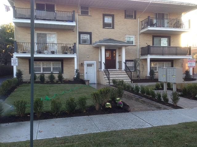 New front appearance with pavers and sodded lawn