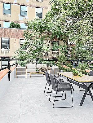 2nd image of 122 E 61st St #Townhouse