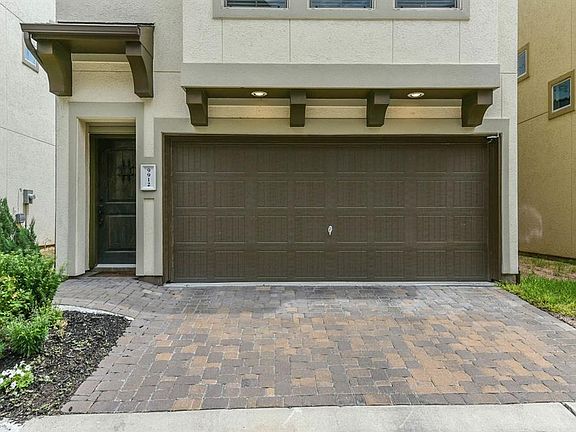 Lovely brick pavers lead to the two car garage.