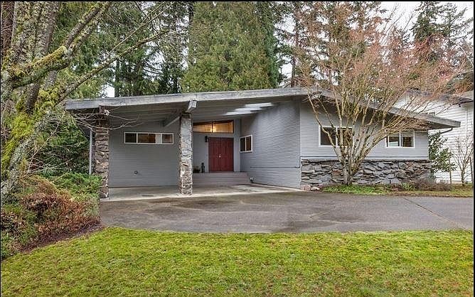 Exterior: Charming curb appeal with mature landscaping and a welcoming entry.