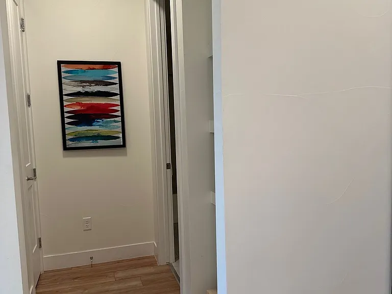 Hallway bathroom on right bedroom on left