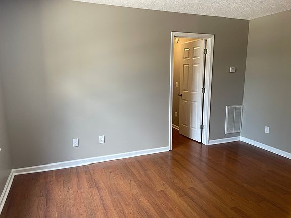 Hallway separating living room and kitchen area from the bedrooms and bath for additional privacy.