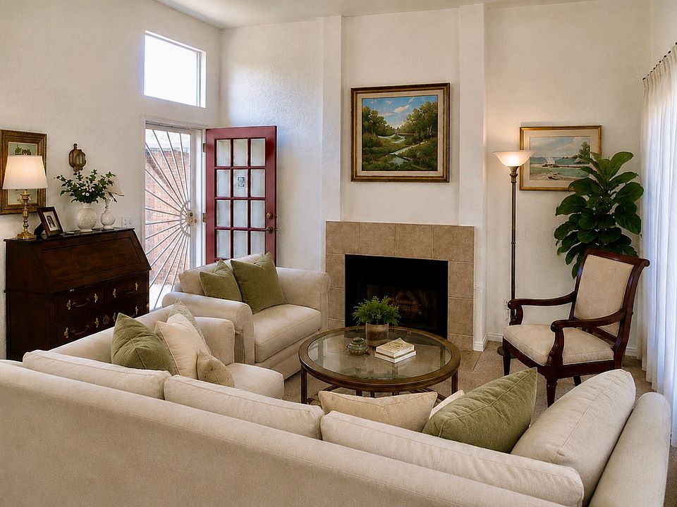 Living room with working fireplace and attached patio