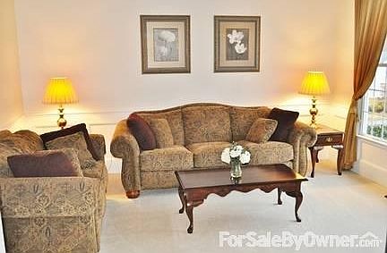 Formal Living Room
						:
						Raised Panel Wainscoting, Chair Rail, Crown Moulding, Ceiling Moldings