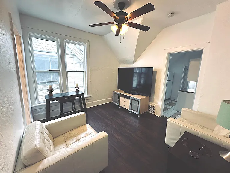 Main room with. Left the bathroom door right straight the kitchen, second back entry staircase to back yard, bedroom in the back.