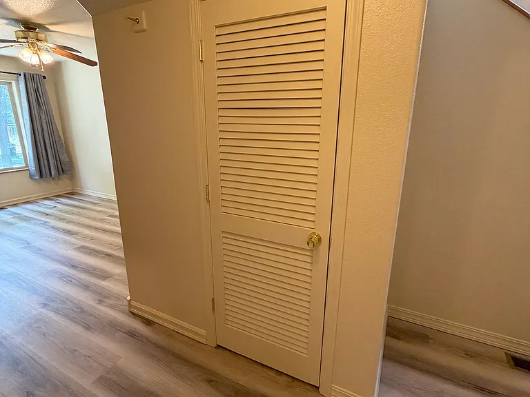 Under stairs closet and hot water heater.
