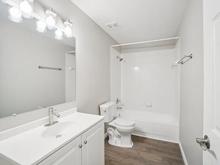 Fully updated second bathroom with fresh, modern tile and fixtures.
