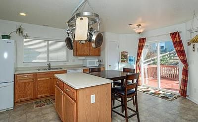 Kitchen opens to relaxing deck
