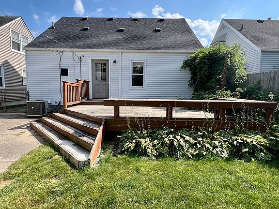 Fenced backyard with deck