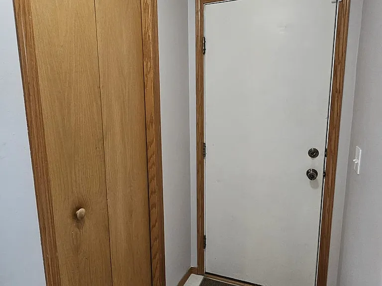 closet and door to garage on main level by the kitchen