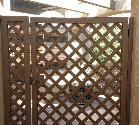 Front entry to patio, trellis door.