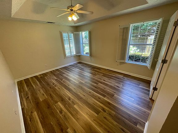 Master bedroom with plantation shutters.