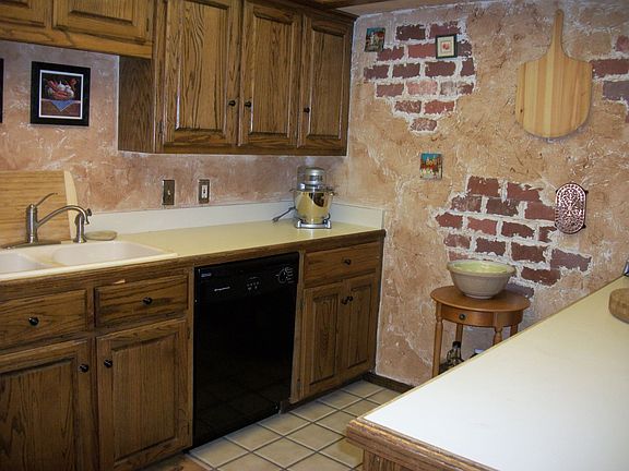 Kitchen has lots of counter space and custom paint