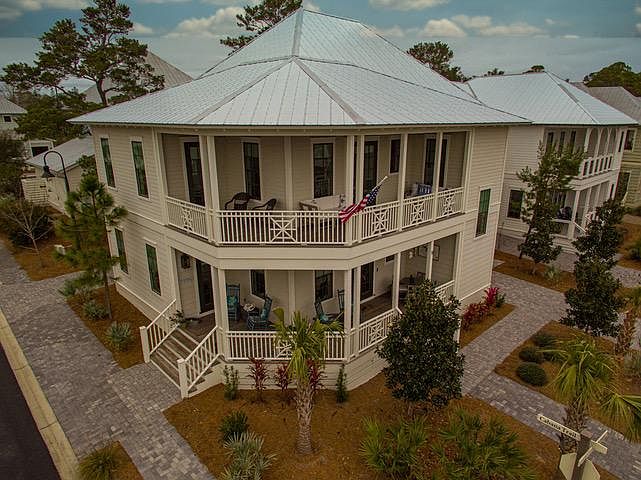 Beautiful corner lot with panoramic views from upper balconies and lower porches. Dining table for 4 on lower level patio.