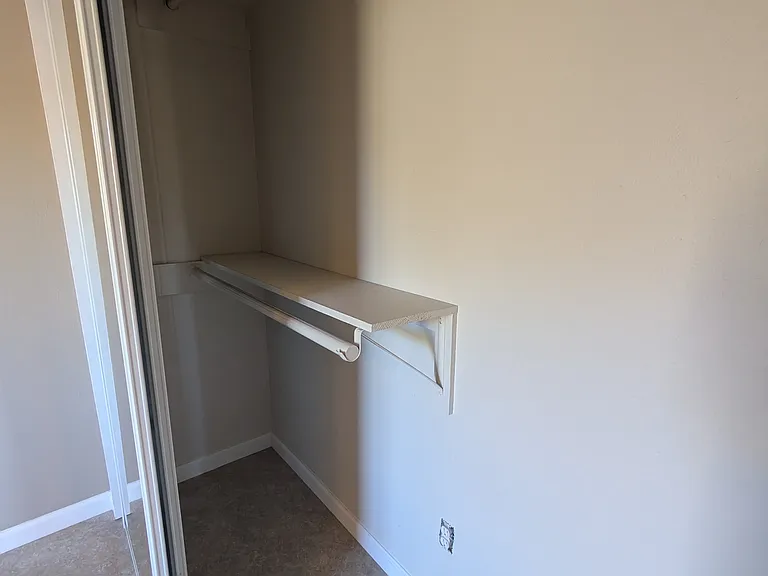 Closet 6'8"L x 2'W x 6'11" (H from floor to bottom of top shelf)