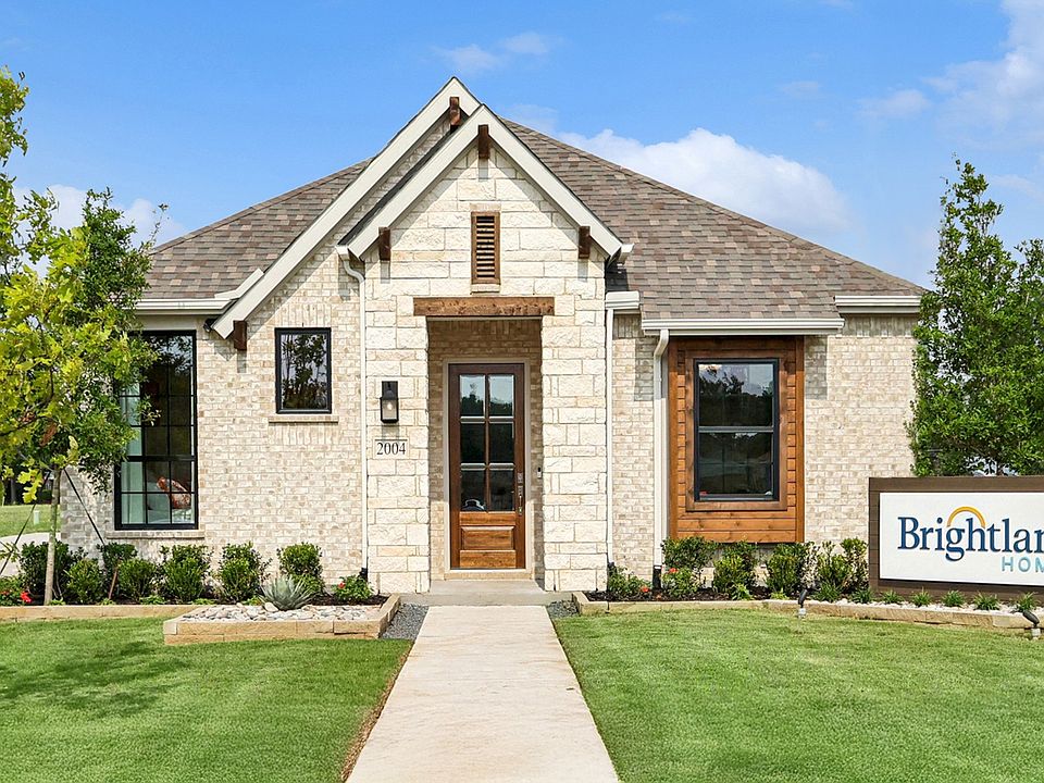 Exquisite stone facade and gabled roof highlight this Heritage Park home s elegance.