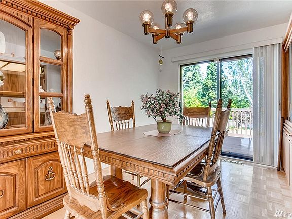 A formal dining room lies just off the kitchen. Outside a deck and enormous backyard.