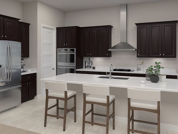 A generous walk-in pantry keeps the quartz countertops in this modern kitchen tidy, while a center i