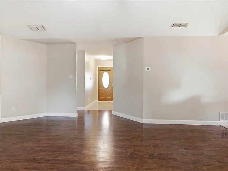 looking at the front door entry from the living room