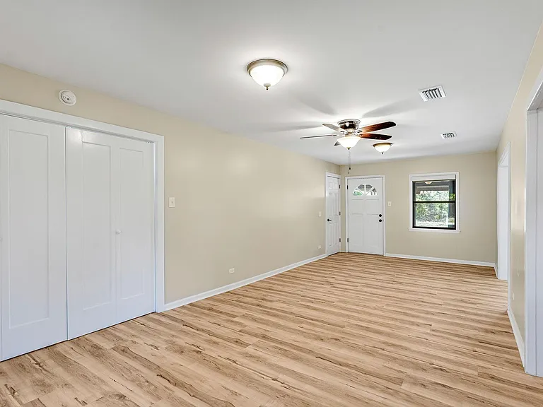 Another view of the den/game room. Laundry is behind the double doors on the left.