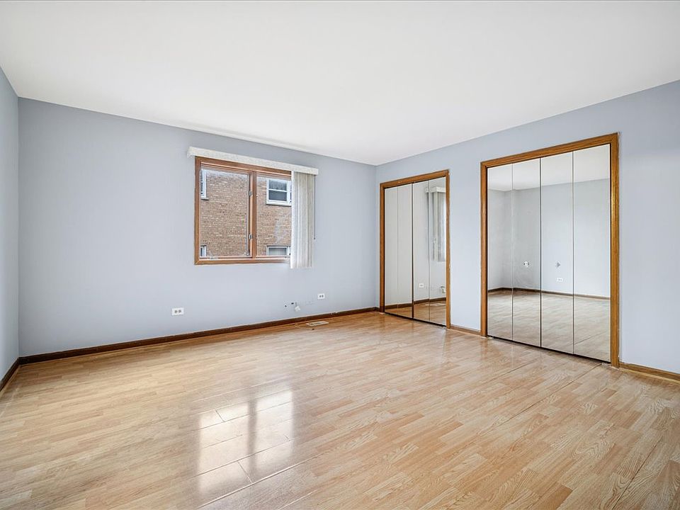 primary suite with double closets and a private bath