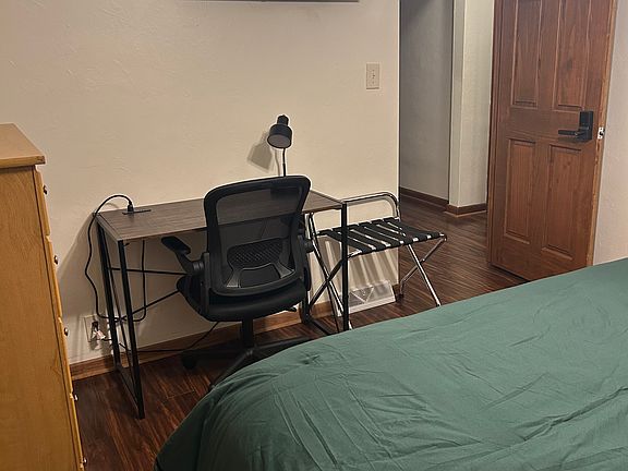 This is the private work space in the locked private bedroom you would be staying in. There is also a luggage rack and a closet in this room. (closet not shown in the photo)
