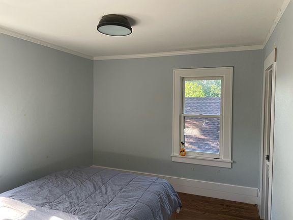 Second Bedroom, freshly painted with new baseboards.