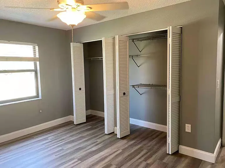 Bedroom 3, unfurnished, with 2 shelved closets