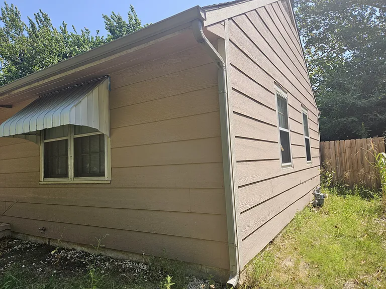 South side of house looking toward privacy fence